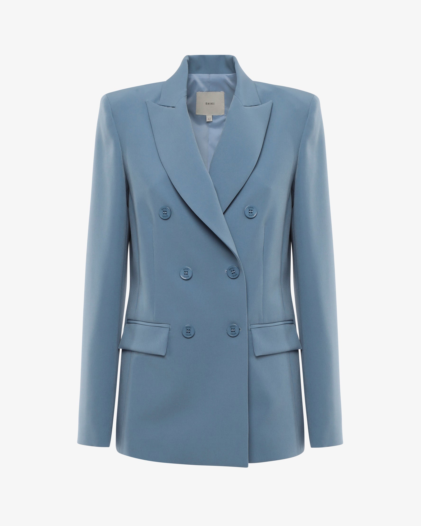Tailleur in tessuto tecnico con giacca doppiopetto e pantalone flare